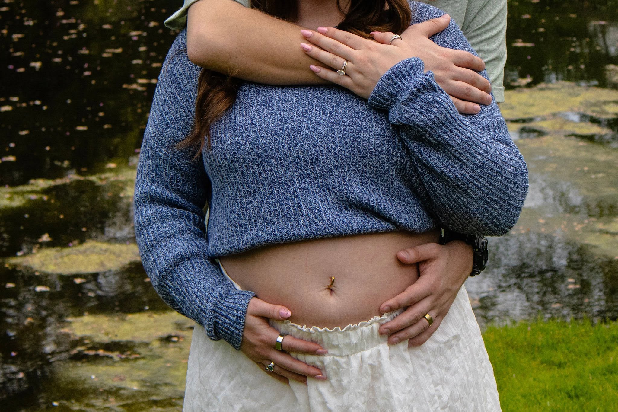 Maternity belly portrait by the water