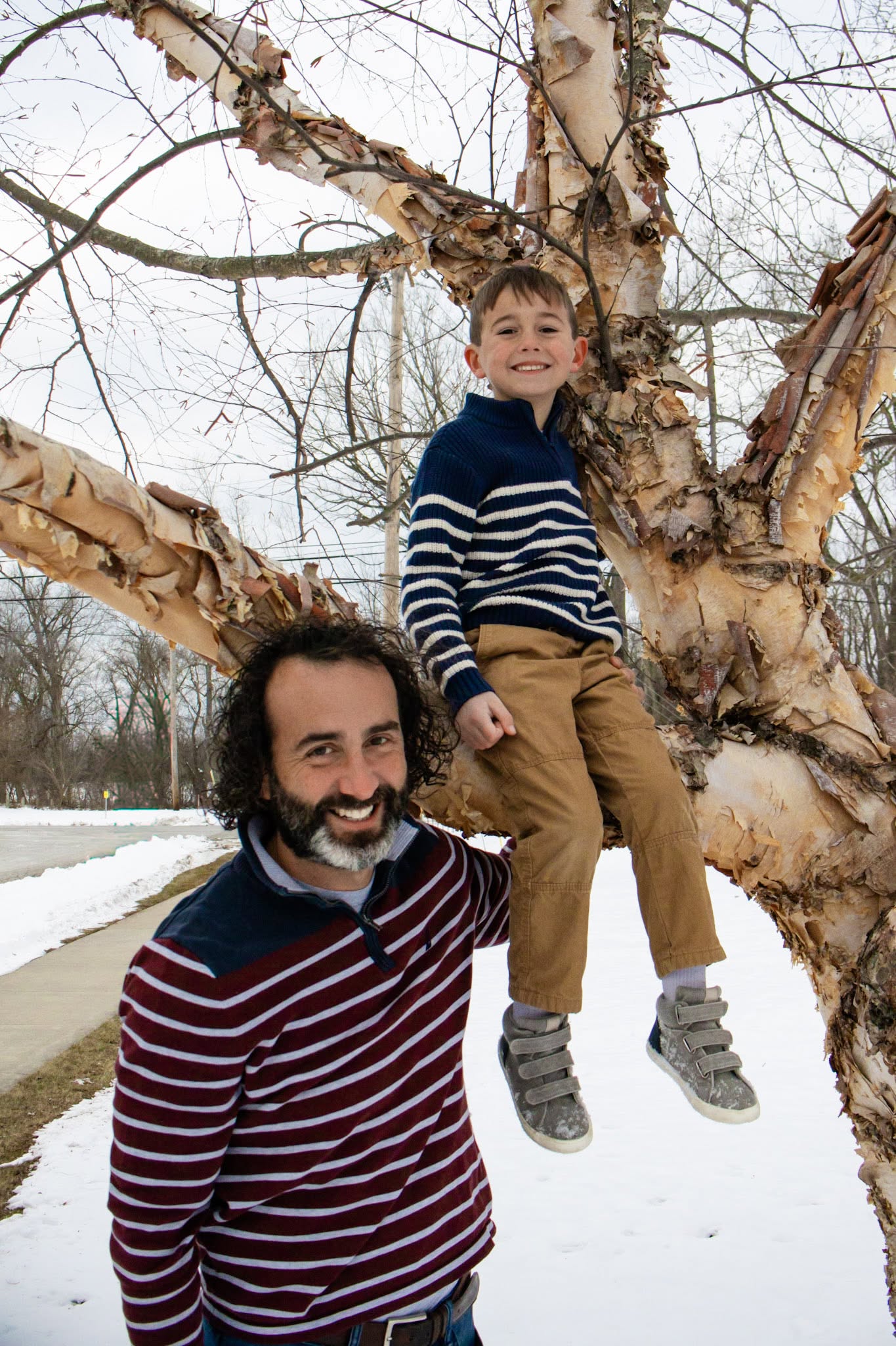 Father and son by a birch tree